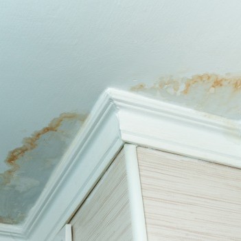 Leaking roof being repaired