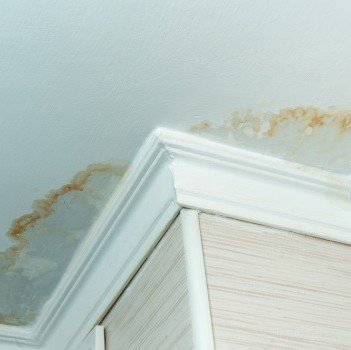 Leaking roof being repaired